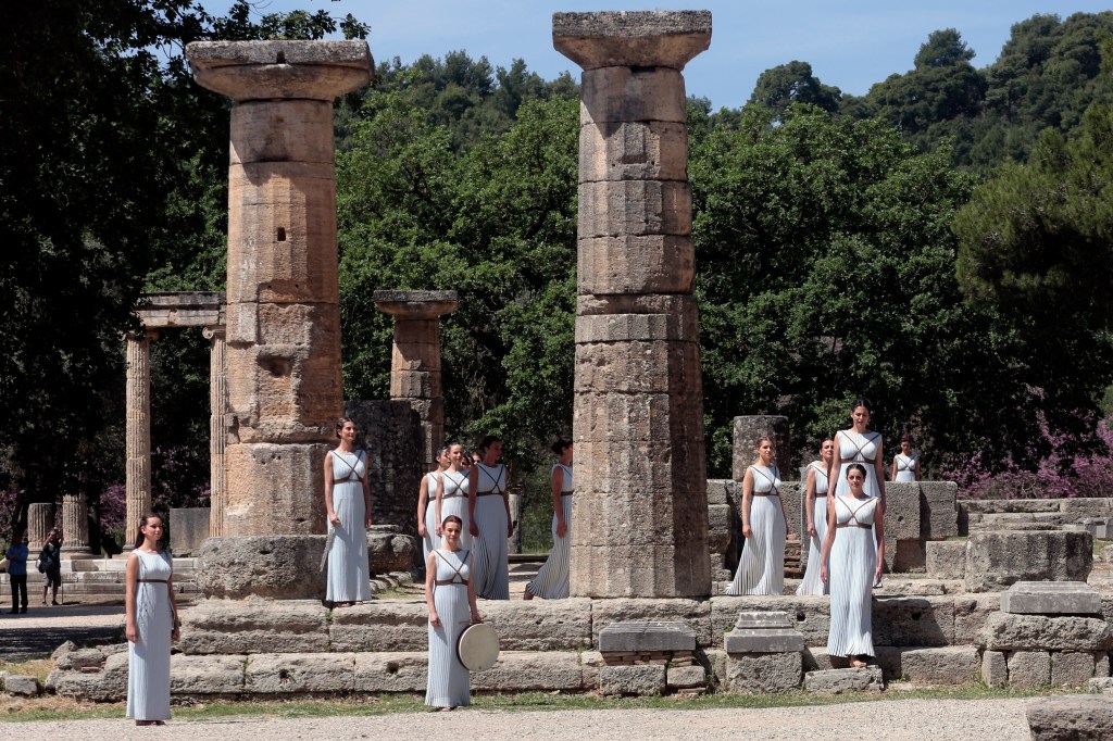 OLYMPIA, GREECE - APRIL 20: High pristesses perform at the Ancient Stadium during the Rehearsal for the Lighting Ceremony of the Olympic Flame at Ancient Olympia on April 20, 2016 in Olympia, Greece. (Photo by Milos Bicanski/Getty Images)