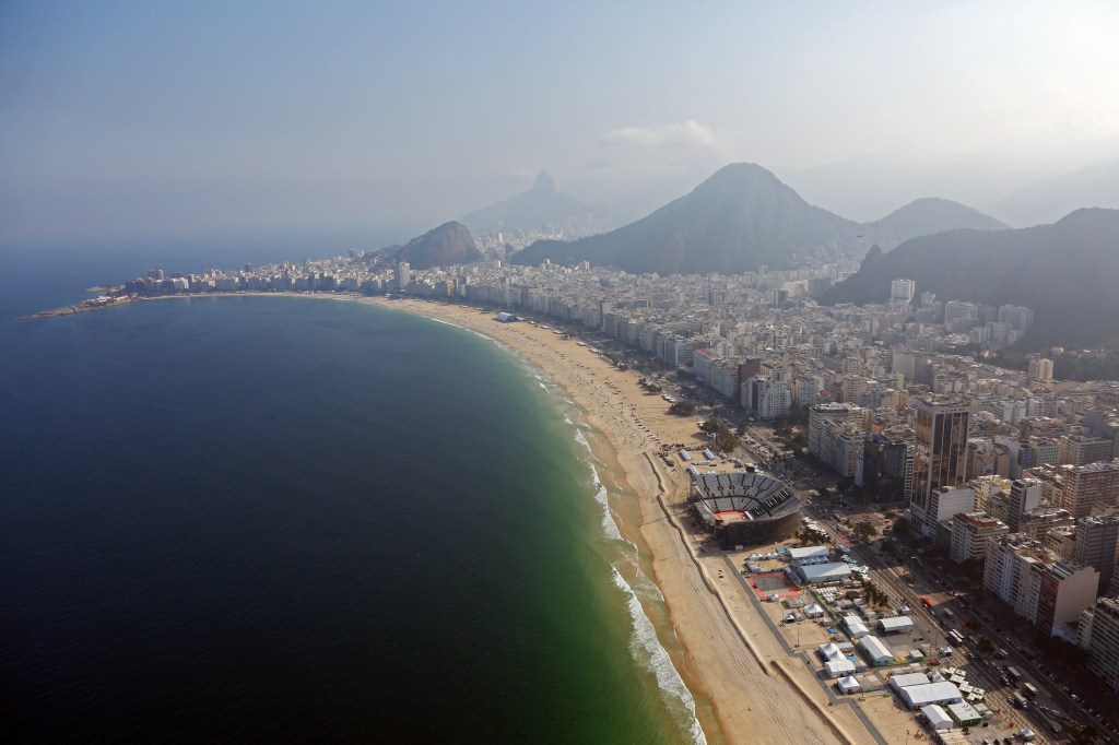 RIO DE JANEIRO, BRAZIL - JULY 25: Work continues on the Olympic Beach Volleyball Arena on Copacabana beach in preparation for the 2016 Summer Olympic Games on July 25, 2016 in Rio de Janeiro, Brazil. (Photo by Michael Heiman/Getty Images)