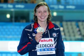 Katie Ledecky smiles with her gold medal Saturday