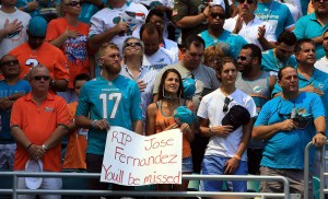 MIAMI GARDENS, FL - SEPTEMBER 25: Fan's stand for a moment of silences for Miami Marlins Pitcher Jose Fernandez prior to a game between the Miami Dolphins and the Cleveland Browns on September 25, 2016 in Miami Gardens, Florida. Fernandez was killed in a boating accident early this morning.  (Photo by Marc Serota/Getty Images)