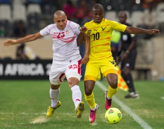 NELSPRUIT, SOUTH AFRICA - JANUARY 30:  Wahbi Khazri of Tunisia (L) and Floyd Ama Ayite of Togo during the 2013 Orange African Cup of Nations match between Togo and Tunisia at Mbombela Stadium on January 30, 2013 in Nelspruit, South Africa.(Photo by Manus van Dyk/Gallo Images/Getty Images)