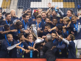 PHILADELPHIA, PA - SEPTEMBER 30: Sporting Kansas City celebrates with the Lamar Hunt trophy after defeating the Philadelphia Union in penalty kicks on September 30, 2015 at PPL Park in Chester, Pennsylvania. (Photo by Mitchell Leff/Getty Images)