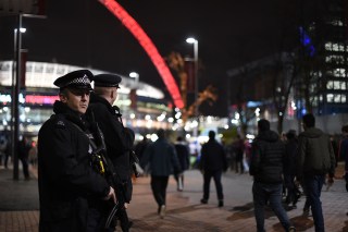 LONDON, ENGLAND - NOVEMBER 17: Armed Police Officers stand outside Wembley Stadium ahead of tonight's International friendly match between England and France at Wembley Stadium on November 17, 2015 in London, England. (Photo by Ben Pruchnie/Getty Images)