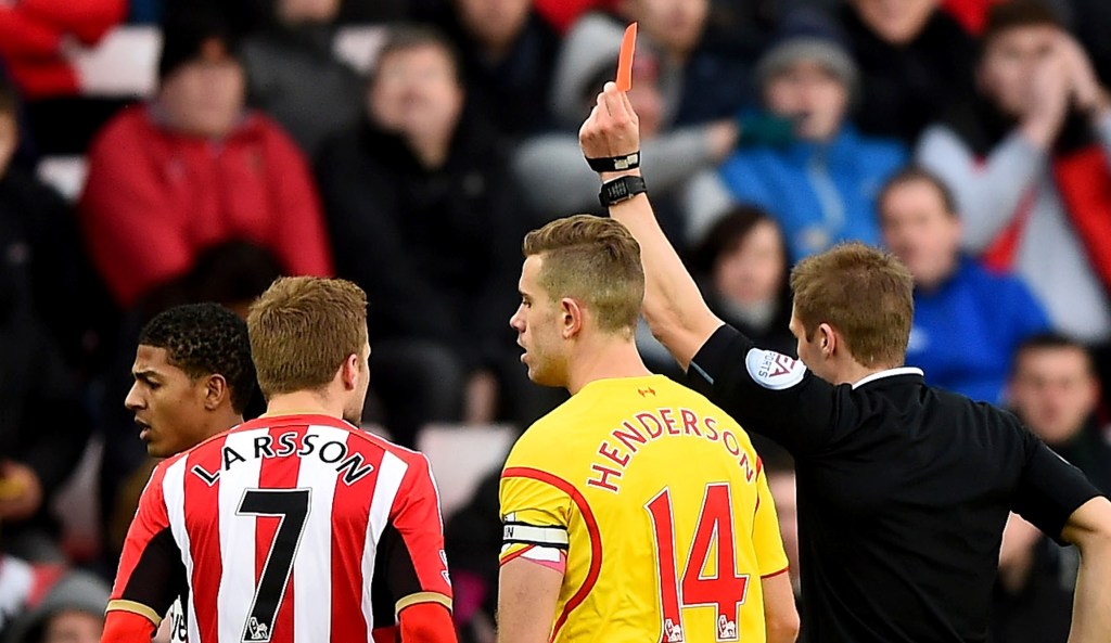 SUNDERLAND, ENGLAND - JANUARY 10: Referee Craig Pawson shows a red card to Liam Bridcutt of Sunderland during the Barclays Premier League match between Sunderland and Liverpool at Stadium of Light on January 10, 2015 in Sunderland, England. (Photo by Laurence Griffiths/Getty Images)