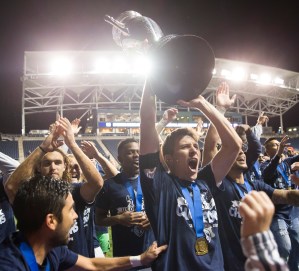 PHILADELPHIA, PA - SEPTEMBER 30: Krizstian Nemeth #9 of Sporting Kansas City holds up the Lamar Hunt trophy after defeating the Philadelphia Union in the U.S. Open Cup Final on September 30, 2015 at PPL Park in Chester, Pennsylvania. Sporting Kansas City defeated the Philadelphia Union in penalty kicks. (Photo by Mitchell Leff/Getty Images)