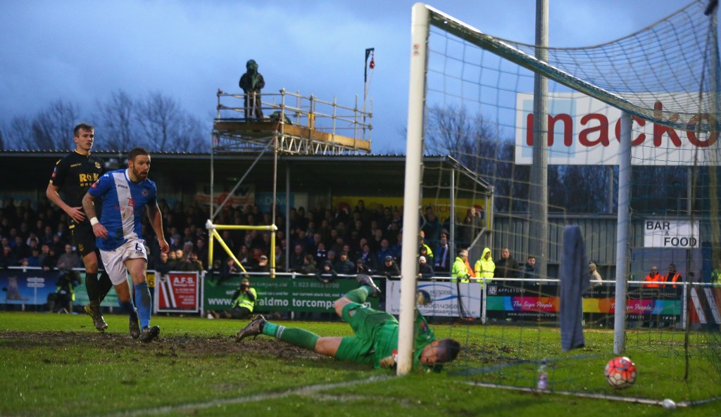 EASTLEIGH, HAMPSHIRE - JANUARY 09: Ben Amos of Bolton Wanderers fails to stop the Eastleigh's first goal scored by Dorian Dervite (L) of Bolton Wanderers during the Emirates FA Cup third round match between Eastleigh and Bolton Wanderers at Silverlake Stadium on January 9, 2016 in Eastleigh, Hampshire. (Photo by Michael Steele/Getty Images)