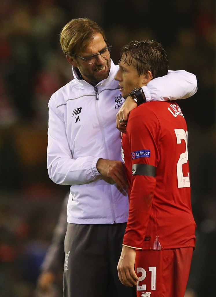 LIVERPOOL, ENGLAND - NOVEMBER 26: Jurgen Klopp manager of Liverpool embraces Lucasof Liverpool after victory in the UEFA Europa League Group B match between Liverpool FC and FC Girondins de Bordeaux at Anfield on November 26, 2015 in Liverpool, United Kingdom. (Photo by Alex Livesey/Getty Images)