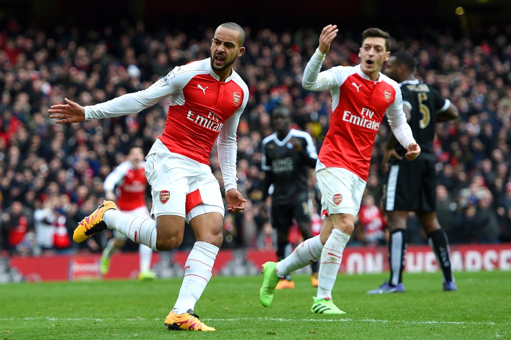 LONDON, ENGLAND - FEBRUARY 14: Theo Walcott of Arsenal celebrates after scoring his team's first goal during the Barclays Premier League match between Arsenal and Leicester City at Emirates Stadium on February 14, 2016 in London, England. (Photo by Ross Kinnaird/Getty Images)