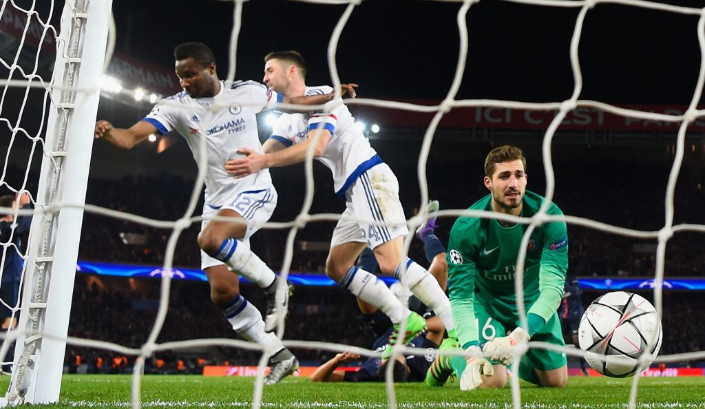 PARIS, FRANCE - FEBRUARY 16: John Mikel Obi of Chelsea (L) celebrates with Gary Cahill as he scores their first and equalising goal past goalkeeper Kevin Trapp of Paris Saint-Germain during the UEFA Champions League round of 16 first leg match between Paris Saint-Germain and Chelsea at Parc des Princes on February 16, 2016 in Paris, France. (Photo by Mike Hewitt/Getty Images)