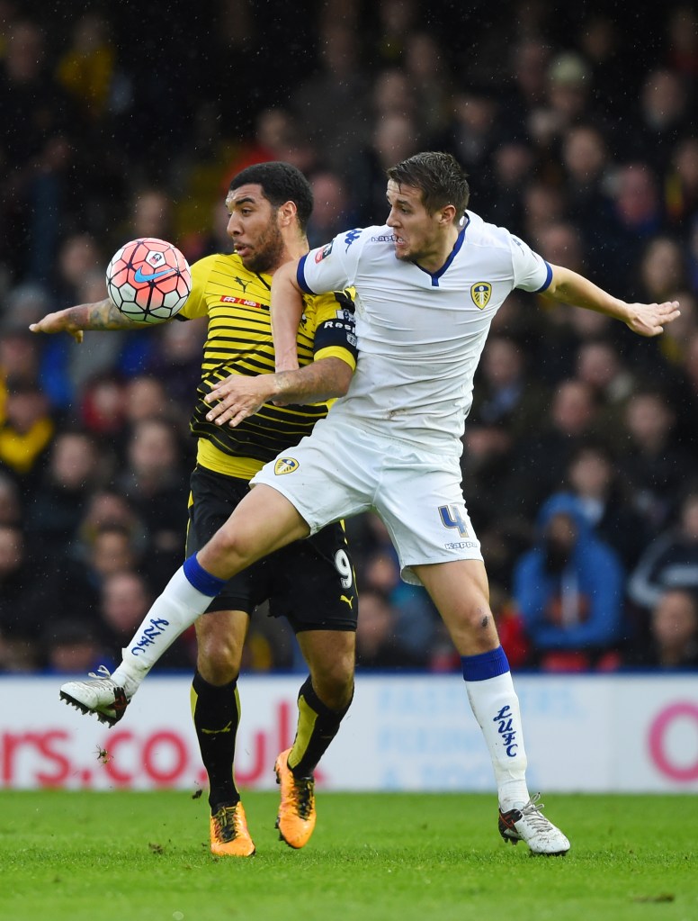 WATFORD, ENGLAND - FEBRUARY 20: Scott Wootton of Leeds United and Troy Deeney of Watford compete for the ball during the Emirates FA Cup fifth round match  between Watford and Leeds United at Vicarage Road on February 20, 2016 in Watford, England.  (Photo by Shaun Botterill/Getty Images)