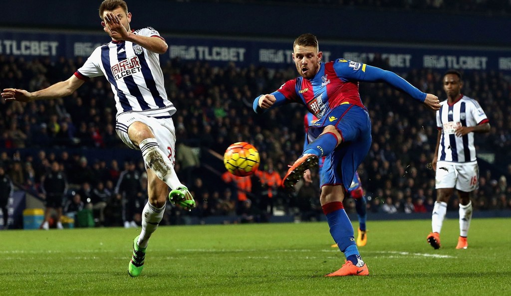 WEST BROMWICH, ENGLAND - FEBRUARY 27: Connor Wickham of Crystal Palace shoots past Gareth McAuley of West Bromwich Albion to score their second goal during the Barclays Premier League match between West Bromwich Albion and Crystal Palace at The Hawthorns on February 27, 2016 in West Bromwich, England. (Photo by Nigel Roddis/Getty Images)