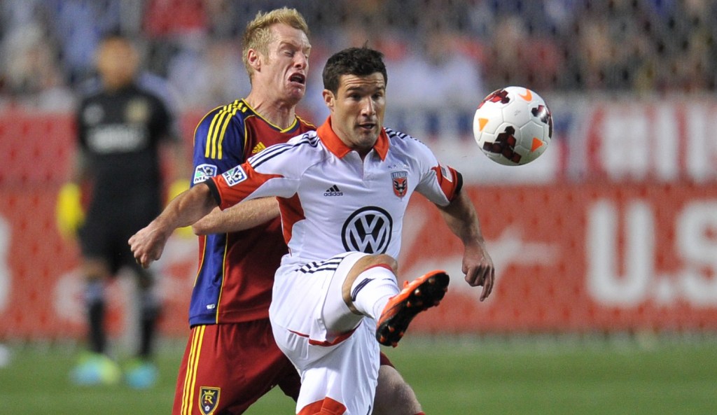 SANDY, UT - OCTOBER 1: Chris Pontius #13 of D.C. United kicks the ball away from Nat Borchers #6 of Real Salt Lake at Rio Tinto Stadium October 1, 2013 in Sandy, Utah. (Photo by Gene Sweeney Jr/Getty Images)
