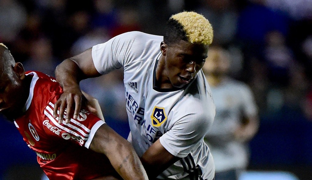 CARSON, CA - FEBRUARY 09:  Gyasi Zardes #11 of Los Angeles Galaxy attemps to break away from Leiton Jimenez #30 of Club Tijuana at StubHub Center on February 9, 2016 in Carson, California.  (Photo by Harry How/Getty Images)