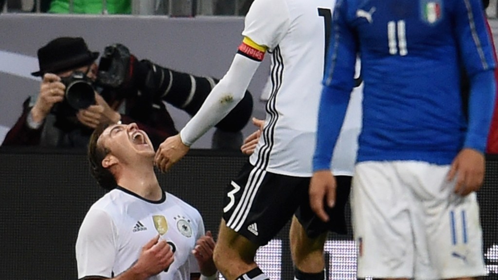 MUNICH, GERMANY - MARCH 29: Mario Gotze of Germany (L) celebrates after scoring the second goal during the international friendly match between Germany and Italy at Allianz Arena on March 29, 2016 in Munich, Germany. (Photo by Claudio Villa/Getty Images)