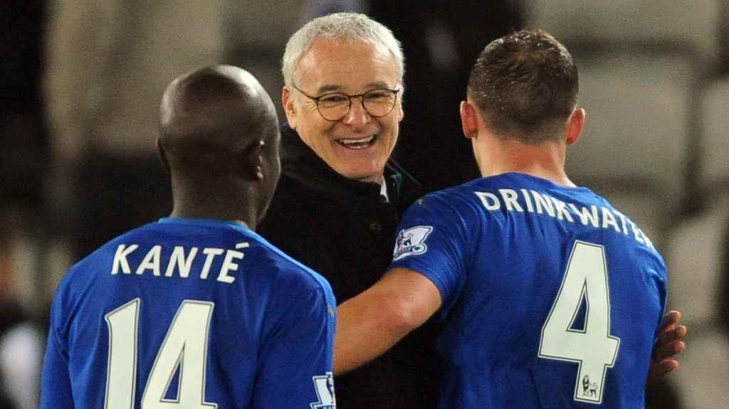 Leicester manager Claudio Ranieri congratulates Daniel Drinkwater, right, and Ngolo Kante, left, after the English Premier League soccer match between Leicester City and Newcastle United at the King Power Stadium in Leicester, England, Monday, March 14, 2016. (AP Photo/Rui Vieira)