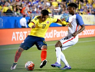 Colombia forward Roger Martinez (17) works against U.S. defender Kellyn Acosta (2) for space during the first half of an Olympic qualifying soccer match Tuesday, March 29, 2016, in Frisco, Texas. (AP Photo/Brandon Wade)