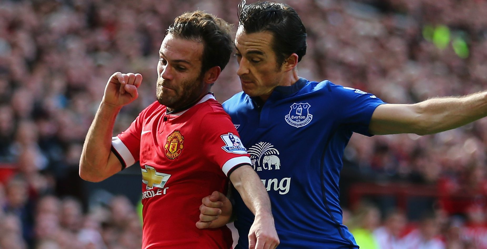 MANCHESTER, ENGLAND - OCTOBER 05: Leighton Baines of Everton competes with Juan Mata of Manchester United during the Barclays Premier League match between Manchester United and Everton at Old Trafford on October 5, 2014 in Manchester, England. (Photo by Clive Brunskill/Getty Images)