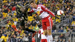 COLUMBUS, OH - NOVEMBER 22: Kei Kamara #23 of the Columbus Crew SC heads the ball past Matt Miazga #20 of the New York Red Bulls during the first half on November 22, 2015 at MAPFRE Stadium in Columbus, Ohio. (Photo by Kirk Irwin/Getty Images)