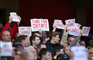 LONDON, ENGLAND - APRIL 30: Arsenal supportes hold banners 'Time For Change' during the Barclays Premier League match between Arsenal and Norwich City at The Emirates Stadium on April 30, 2016 in London, England (Photo by Paul Gilham/Getty Images)