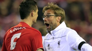 Liverpool's Dejan Lovren, left, and Liverpool's head coach Juergen Klopp celebrate after winning the Europa League quarterfinal second leg soccer match between Liverpool FC and Borussia Dortmund in Liverpool, England, Thursday, April 14, 2016 . (AP Photo/Jon Super)