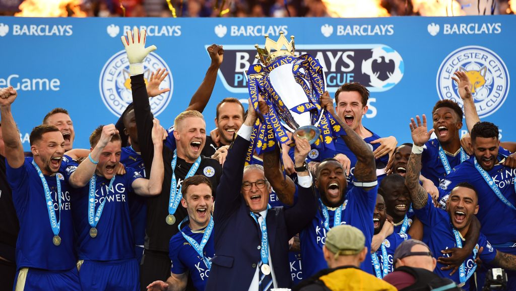LEICESTER, ENGLAND - MAY 07:  Captain Wes Morgan and manager Claudio Ranieri of Leicester City lift the Premier League Trophy after the Barclays Premier League match between Leicester City and Everton at The King Power Stadium on May 7, 2016 in Leicester, United Kingdom.  (Photo by Laurence Griffiths/Getty Images)
