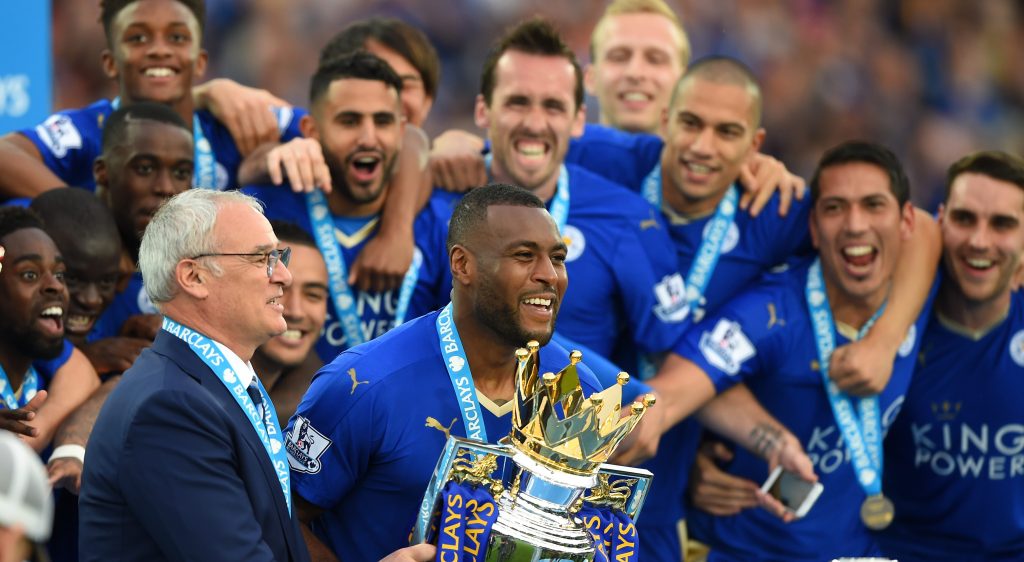 LEICESTER, ENGLAND - MAY 07:  Captain Wes Morgan and manager Claudio Ranieri of Leicester City prepare to lift the Premier League Trophy after the Barclays Premier League match between Leicester City and Everton at The King Power Stadium on May 7, 2016 in Leicester, United Kingdom.  (Photo by Shaun Botterill/Getty Images)