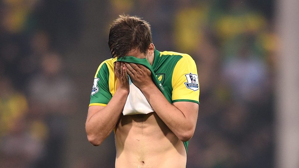 NORWICH, ENGLAND - MAY 11: Ryan Bennett of Norwich City looks dejected during the Barclays Premier League match between Norwich City and Watford at Carrow Road on May 11, 2016 in Norwich, England. (Photo by Ross Kinnaird/Getty Images)