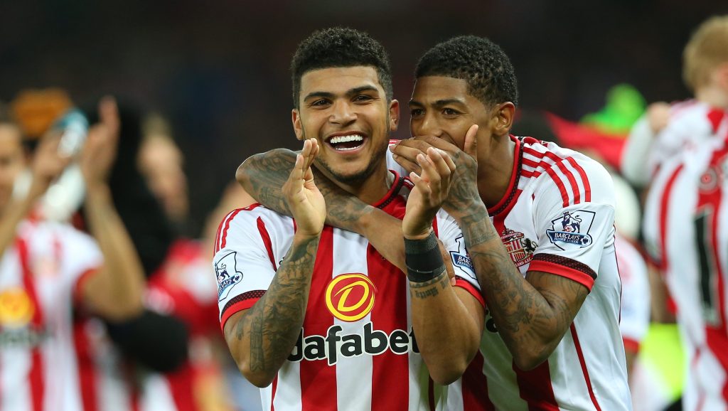 SUNDERLAND, ENGLAND - MAY 11: DeAndre Yedlin and Patrick van Aanholt of Sunderland celebrate staying in the Premier League after the Barclays Premier League match between Sunderland and Everton at the Stadium of Light on May 11, 2016 in Sunderland, England. (Photo by Ian MacNicol/Getty Images)