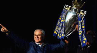 LEICESTER, ENGLAND - MAY 16: (L-R) Claudio Ranieri Manager of Leicester City and captain Wes Morgan of Leicester City show the trophy to the fans during the Leicester City Barclays Premier League winners bus parade on May 16, 2016 in Leicester, England. (Photo by Laurence Griffiths/Getty Images)