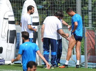 MADRID, SPAIN - MAY 24: Cristiano Ronaldo of Real Madrid is helped after getting injured in the team training session during the Real Madrid Open Media Day ahead of the UEFA Champions League Final against Club Atletico Madrid at Valdebebas training ground on May 24, 2016 in Madrid, Spain. (Photo by Denis Doyle/Getty Images)