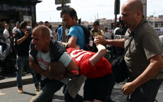 MARSEILLE, FRANCE - JUNE 11: An England fan is arrested after clashing with police ahead of the game against Russia later today on June 11, 2016 in Marseille, France. Football fans from around Europe have descended on France for the UEFA Euro 2016 football tournament. (Photo by Carl Court/Getty Images)
