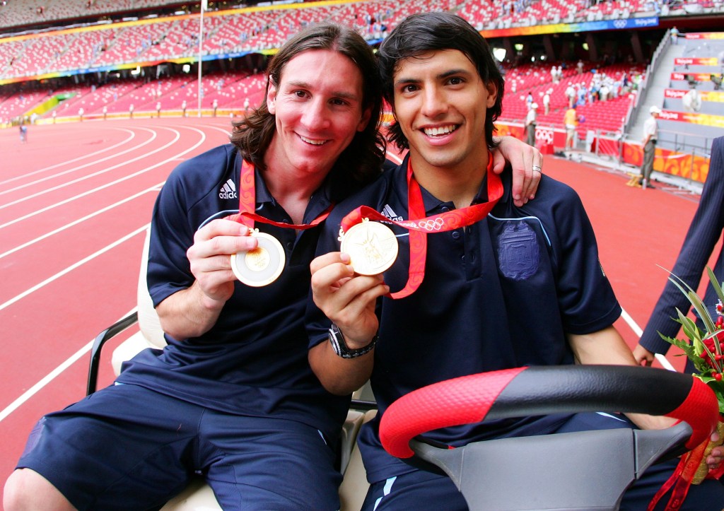 BEIJING - AUGUST 23: Argentinian forwards Lionel Messi (L) and Sergio Aguero gold medal pose during the men's Olympic football tournament medal ceremony at the national stadium in Beijing during the Men's Final between Nigeria and Argentina at the National Stadium on Day 15 of the Beijing 2008 Olympic Games on August 23, 2008 in Beijing, China. (Photo by Koji Watanabe/Getty Images)