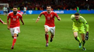 LILLE, FRANCE - JULY 01: (L to R) Joe Ledley, Gareth Bale and Wayne Hennessey of Wales celebrate their team's 3-1 win after the UEFA EURO 2016 quarter final match between Wales and Belgium at Stade Pierre-Mauroy on July 1, 2016 in Lille, France. (Photo by Stu Forster/Getty Images)