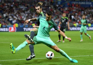 LYON, FRANCE - JULY 06: Gareth Bale of Wales battles for the ball with Jose Fonte of Portugal during the UEFA EURO 2016 semi final match between Portugal and Wales at Stade des Lumieres on July 6, 2016 in Lyon, France. (Photo by Michael Regan/Getty Images)