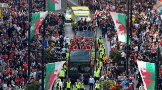CARDIFF, UNITED KINGDOM - JULY 08: The Wales Football squad head down St Mary's street on their bus parade around Cardiff on their EURO 2016 homecoming tour on July 8, 2016 in Cardiff, Wales. (Photo by Stu Forster/Getty Images)