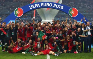 PARIS, FRANCE - JULY 10: Portugal players and staffs celebrate after their 1-0 win against France in the UEFA EURO 2016 Final match between Portugal and France at Stade de France on July 10, 2016 in Paris, France. (Photo by Lars Baron/Getty Images)