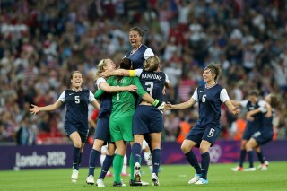 LONDON, ENGLAND - AUGUST 09: Hope Solo #1, Shannon Boxx #7 and Christie Rampone #3, Amy LePeilbet #6, Kelley O'Hara #5 of the United States celebrates after defeating Japan by a score of 2-1 to win the Women's Football gold medal match on Day 13 of the London 2012 Olympic Games at Wembley Stadium on August 9, 2012 in London, England. (Photo by Ronald Martinez/Getty Images)