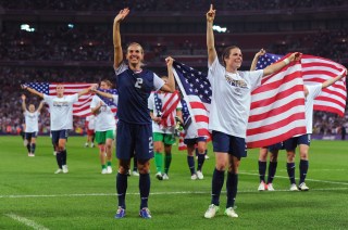 LONDON, ENGLAND - AUGUST 09: Heather Mitts #2 and Kelley O'Hara #5 of United States celebrate their 2-1 gold medal victory over Japan during the Women's Football gold medal match on Day 13 of the London 2012 Olympic Games at Wembley Stadium on August 9, 2012 in London, England. (Photo by Michael Regan/Getty Images)