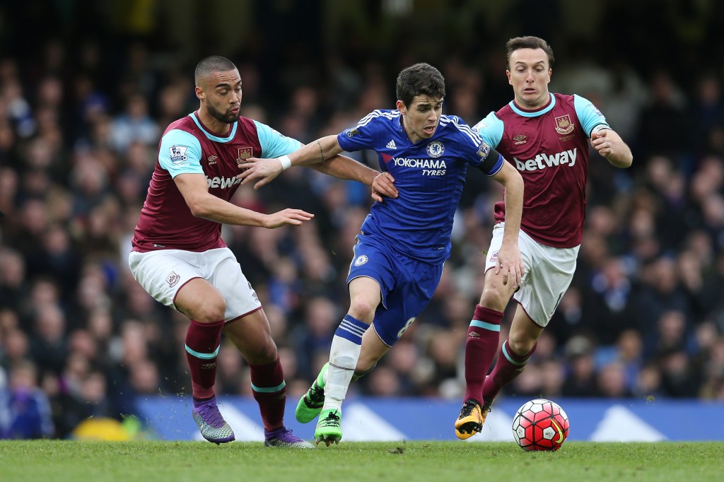 LONDON, ENGLAND - MARCH 19: Oscar (C) of Chelsea controls the ball under pressure of Winston Reid (L) and Mark Noble (R) of West Ham United during the Barclays Premier League match between Chelsea and West Ham United at Stamford Bridge on March 19, 2016 in London, United Kingdom. (Photo by Alex Morton/Getty Images)