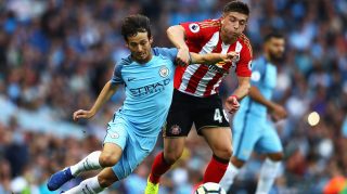 MANCHESTER, ENGLAND - AUGUST 13: Lynden Gooch of Sunderland challenges David Silva of Manchester City during the Premier League match between Manchester City and Sunderland at Etihad Stadium on August 13, 2016 in Manchester, England. (Photo by Michael Steele/Getty Images)