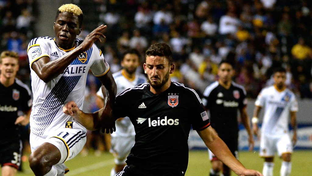 LOS ANGELES, CA - AUGUST 27: Gyasi Zardes #11 of the Los Angeles Galaxy and Steve Birnbaum #15 of D.C. United chase after a ball during the second half against D.C United at StubHub Center on August 27, 2014 in Los Angeles, California. (Photo by Harry How/Getty Images)