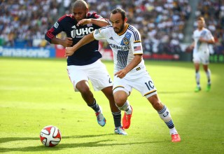 LOS ANGELES, CA - DECEMBER 07: Landon Donovan #10 of the Los Angeles Galaxy plays the ball past Andrew Farrell #2 of the New England Revolution in the first half during the 2014 MLS Cup match at StubHub Center on December 7, 2014 in Los Angeles, California. The Galaxy defeated the Revolution 2-1. (Photo by Victor Decolongon/Getty Images)