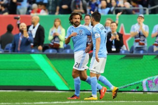 NEW YORK, NY - MARCH 13: David Villa #7 of New York City FC celebrates his first half goal with teamate Andrea Pirlo #21 againd the Toronto FC at Yankee Stadium on March 13, 2016 in the Bronx borough of New York City. (Photo by Mike Stobe/Getty Images)
