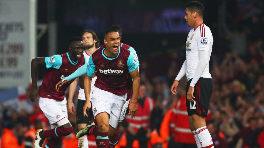 LONDON, ENGLAND - MAY 10: Chris Smalling of Manchester United looks dejected as Winston Reid of West Ham United celebrates as he scores their third goal during the Barclays Premier League match between West Ham United and Manchester United at the Boleyn Ground on May 10, 2016 in London, England. West Ham United are playing their last ever home match at the Boleyn Ground after their 112 year stay at the stadium. The Hammers will move to the Olympic Stadium for the 2016-17 season. (Photo by Julian Finney/Getty Images)
