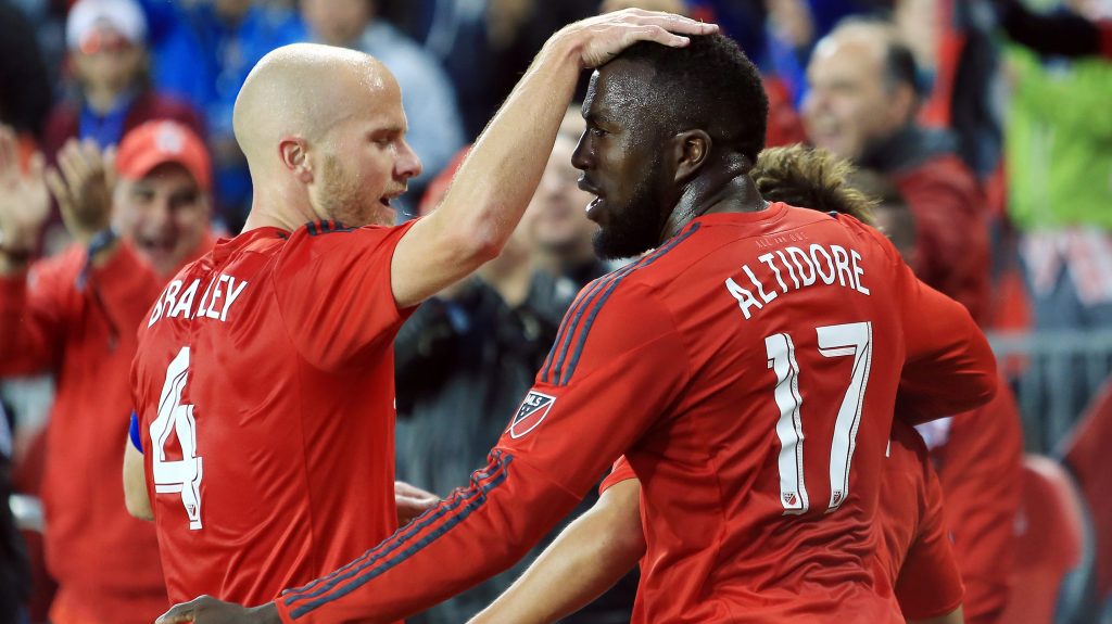 TORONTO, ON - MAY 07: Michael Bradley #4 and Jozy Altidore #17 of Toronto FC celebrate a goal by teammate Tsubasa Endoh #9 during the first half of an MLS soccer game against FC Dallas at BMO Field on May 7, 2016 in Toronto, Ontario, Canada. (Photo by Vaughn Ridley/Getty Images)