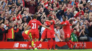 LIVERPOOL, ENGLAND - SEPTEMBER 10: Sadio Mane of Liverpool celebrates scoring his sides second goal with team mates during the Premier League match between Liverpool and Leicester City at Anfield on September 10, 2016 in Liverpool, England. (Photo by Michael Regan/Getty Images)