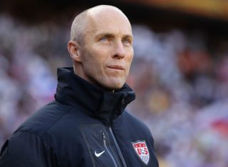 JOHANNESBURG, SOUTH AFRICA - JUNE 18: Bob Bradley head coach of the USA looks thoughtful during the 2010 FIFA World Cup South Africa Group C match between Slovenia and USA at Ellis Park Stadium on June 18, 2010 in Johannesburg, South Africa. (Photo by Ezra Shaw/Getty Images)