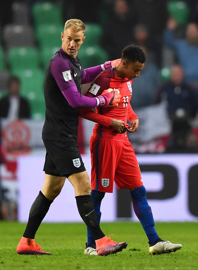 LJUBLJANA, SLOVENIA - OCTOBER 11: Joe Hart of England speaks with team-mate Jesse Lingard during the FIFA 2018 World Cup Qualifier Group F match between Slovenia and England at Stadion Stozice on October 11, 2016 in Ljubljana, Slovenia. (Photo by Laurence Griffiths/Getty Images)