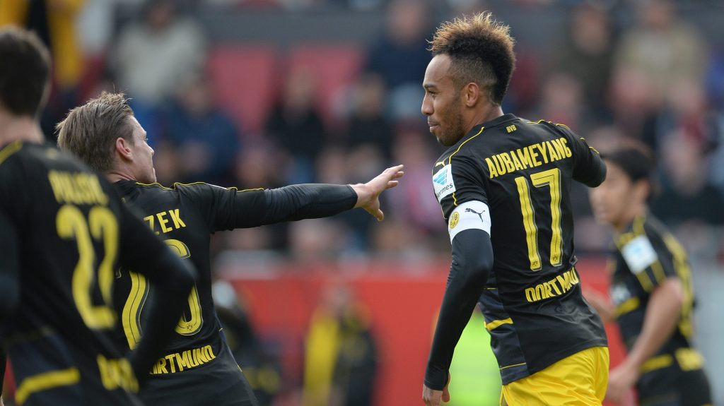 Dortmund's Pierre-Emerick Aubameyang, right, and Lukas Pisczek cheer over a goal during the German Bundesliga soccer match between FC Ingolstadt 04 and Borussia Dortmund in Ingolstadt, Germany, Saturday Oct. 22, 2016. (Andreas Gebert/dpa via AP)