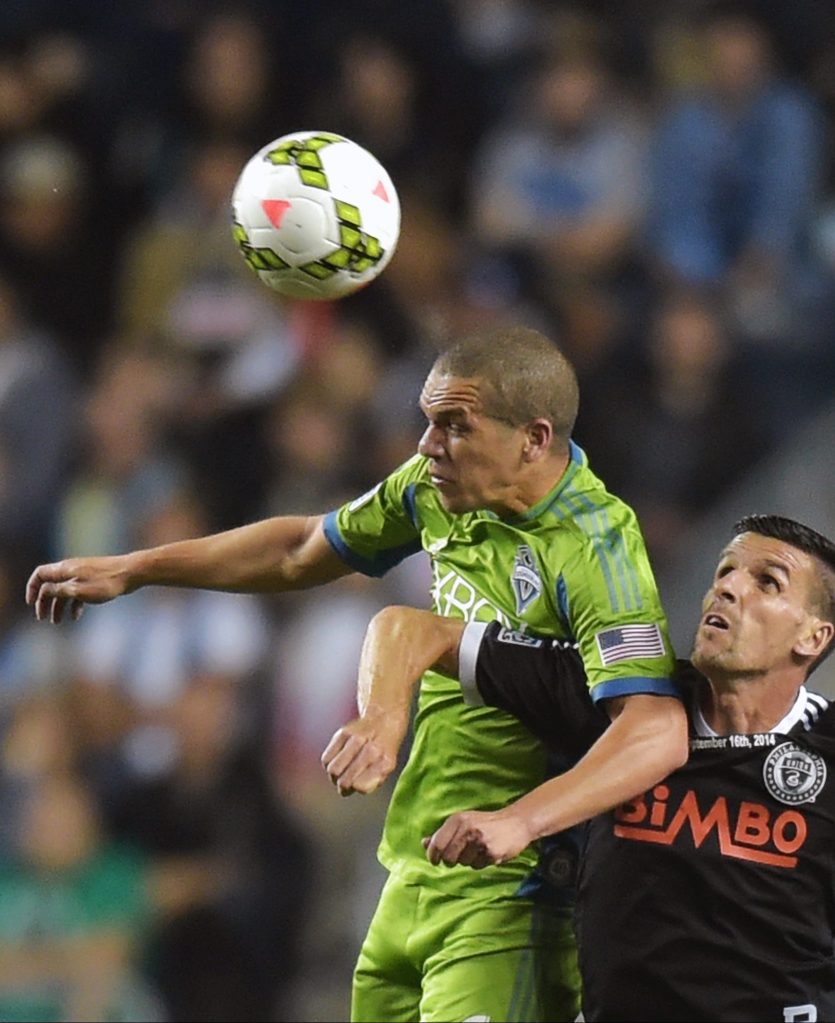 CHESTER, PA - SEPTEMBER 16: Midfielder Osvaldo Alonso #6 of the Seattle Sounders FC heads the ball over forward Sebastien Le Toux #11 of the Philadelphia Union during the 2014 U.S. Open Cup Final at PPL Park on September 16, 2014 in Chester, Pennsylvania. The Sounders won 3-1. (Photo by Drew Hallowell/Getty Images)